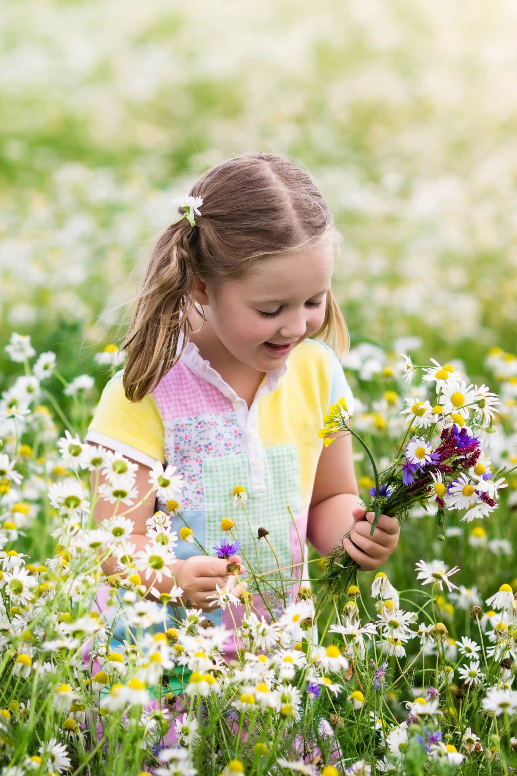 Girl in garden looking for butterflies