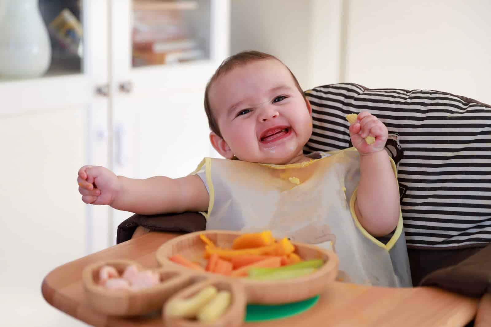 baby eating by themselves