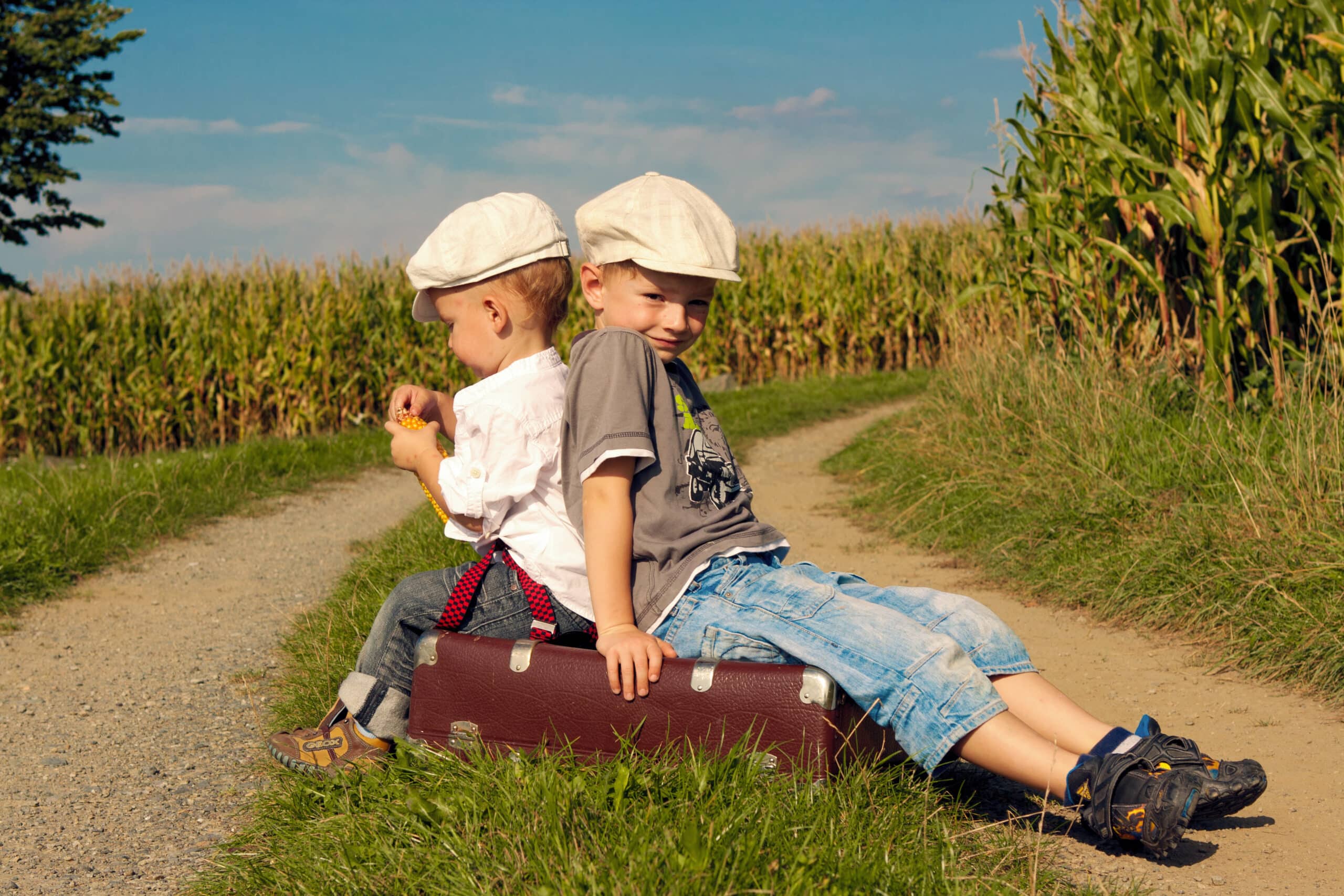 Happy,Traveler Kids sat on a suitcase