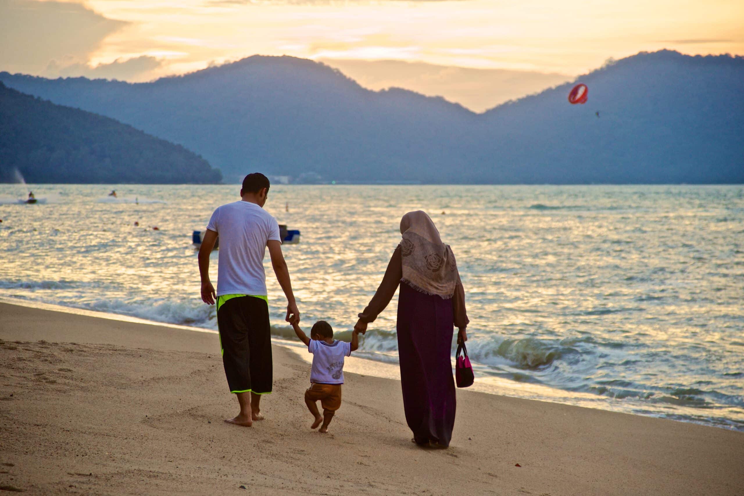 muslim family on the beach