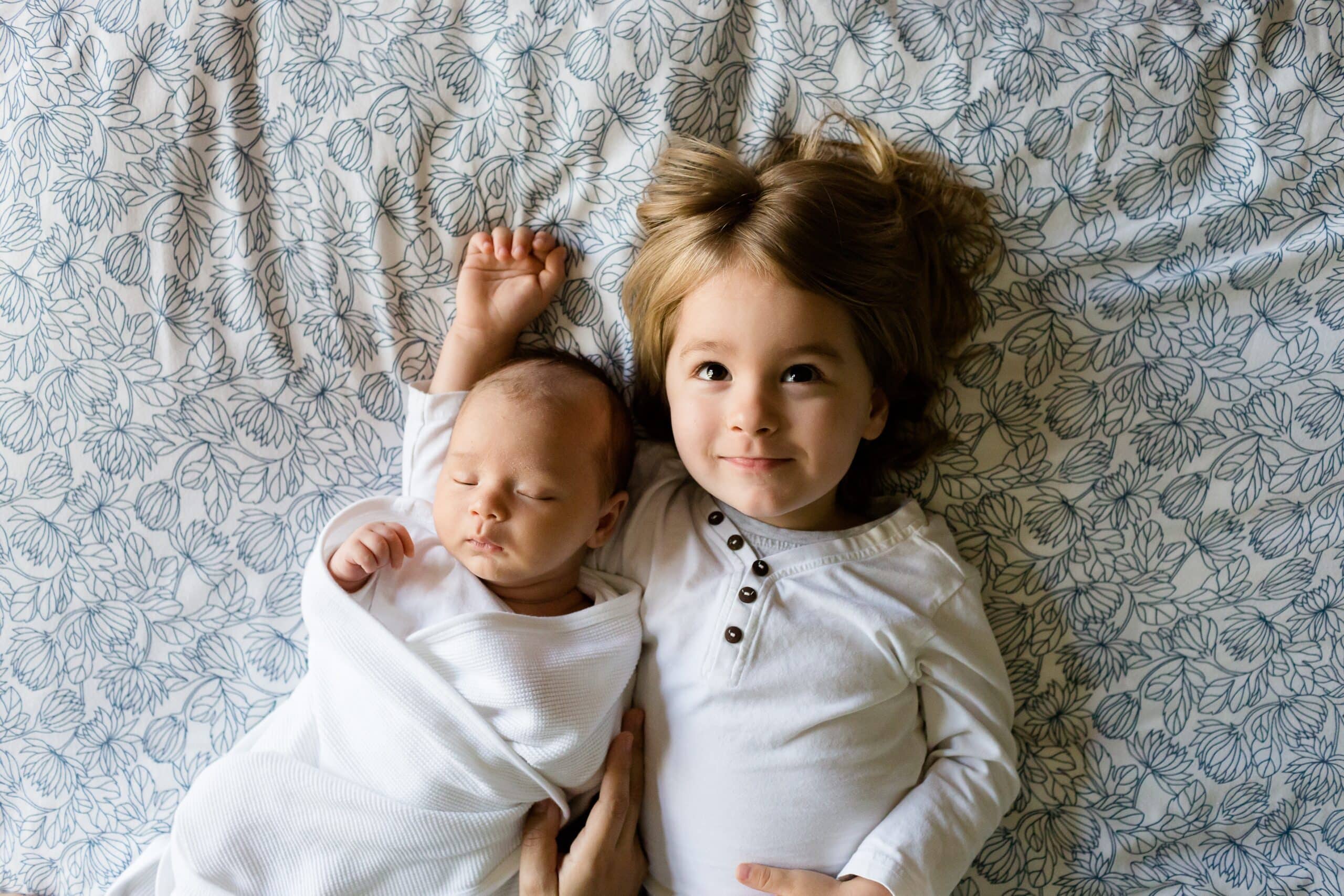 toddler and his baby brother