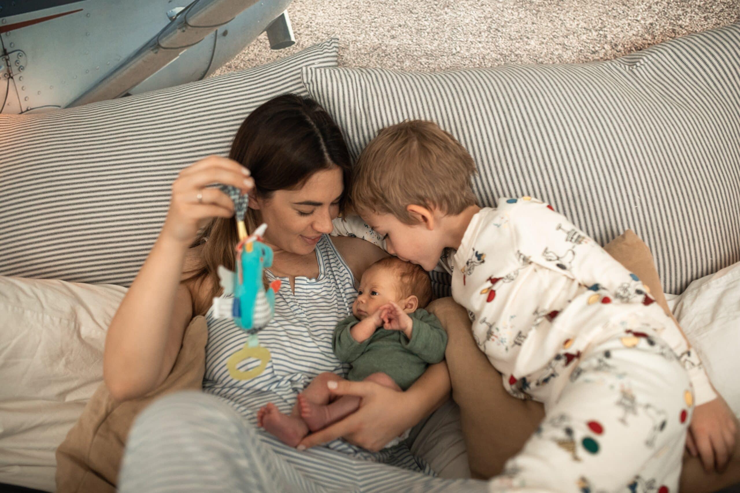 Mum, son & newborn cuddling