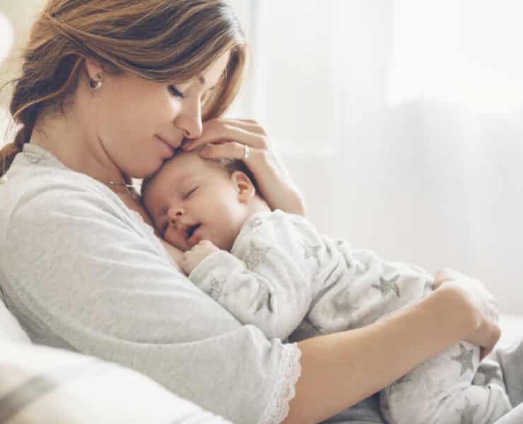 mom holding baby