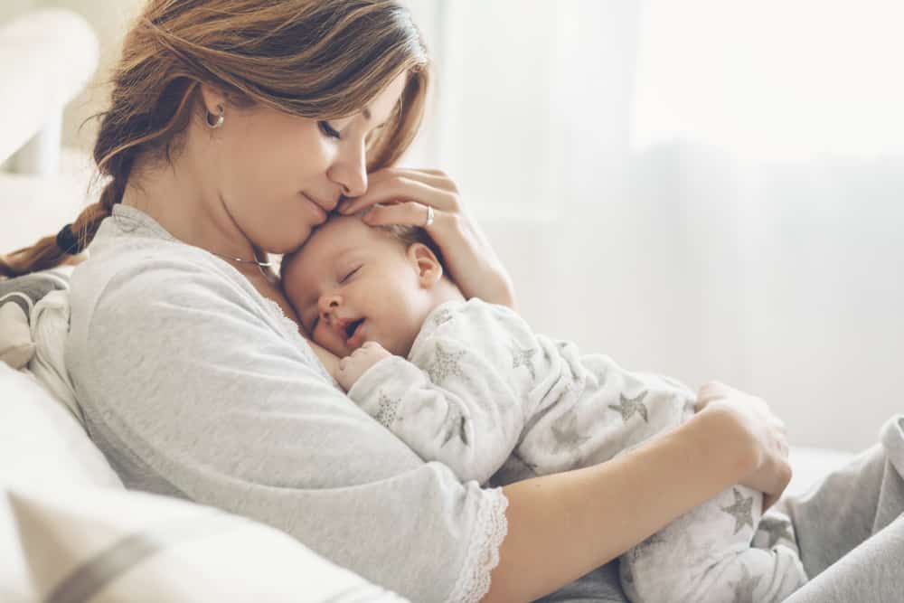 mom holding baby