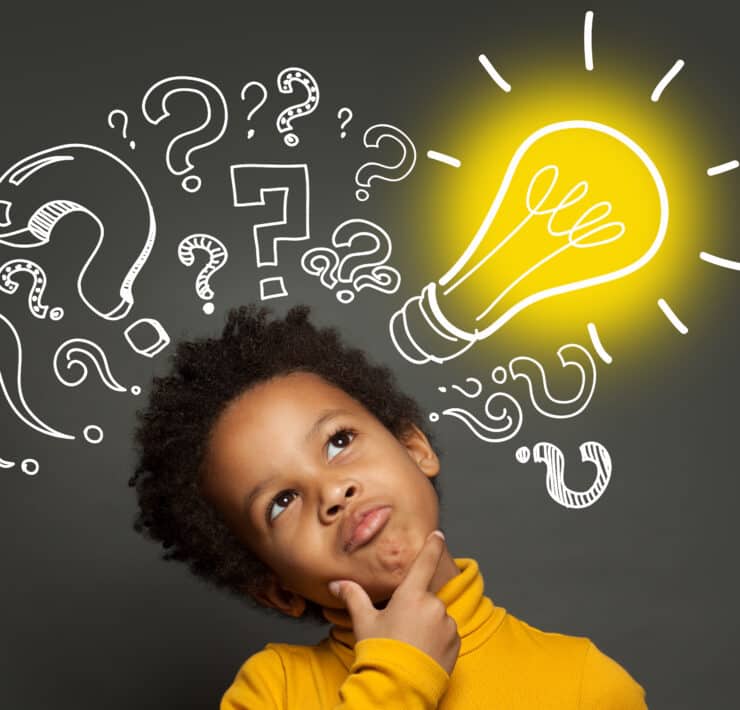 Kid thinking with lightbulb above his head