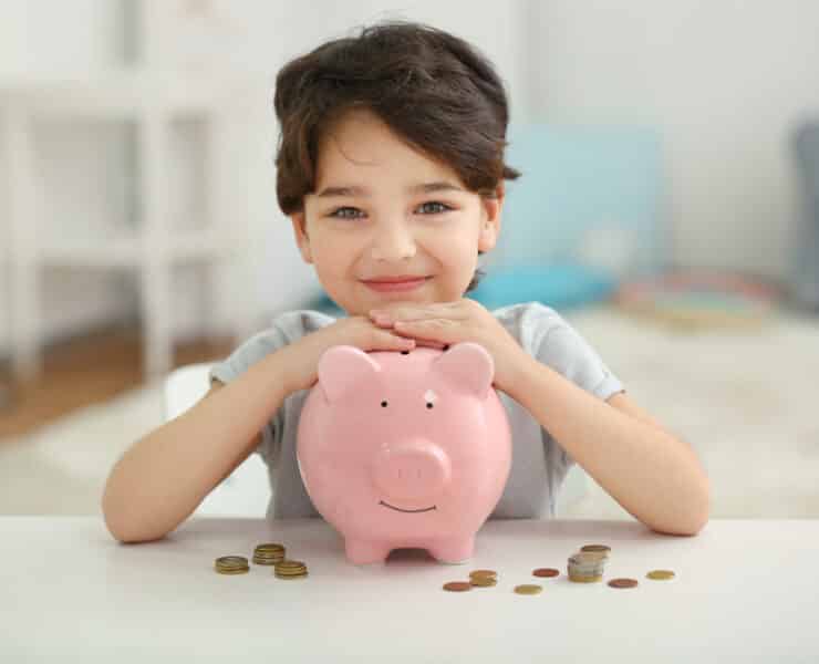 a child with a piggy bank
