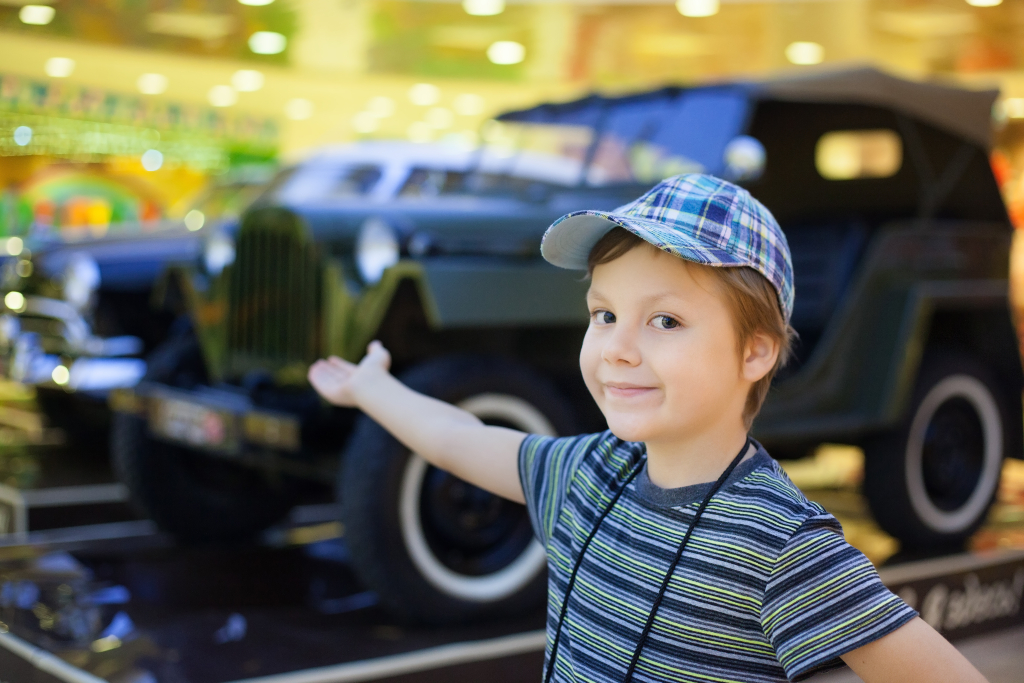 Child with vintage car
