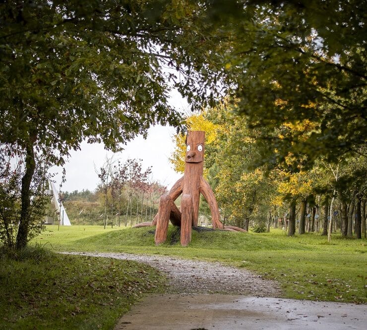 Stick man sculpture in park