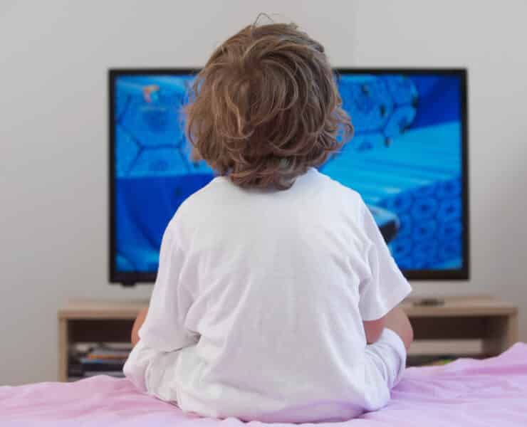 young kid watching a movie