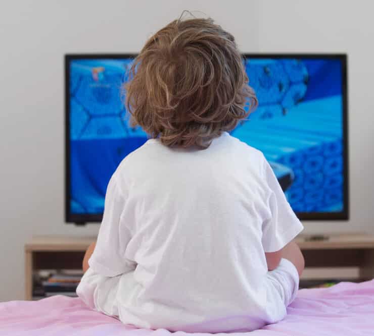 young kid watching a movie