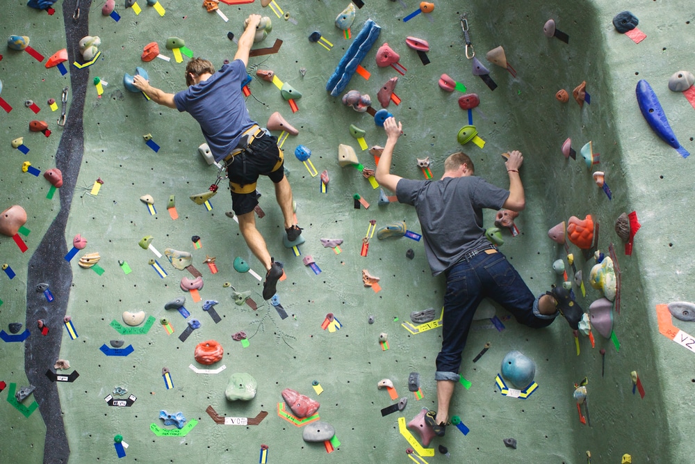 group of guys free climbing