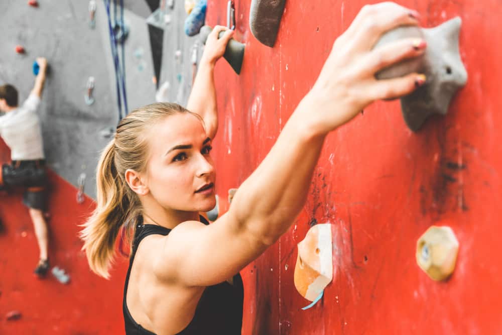 woman rock climbing