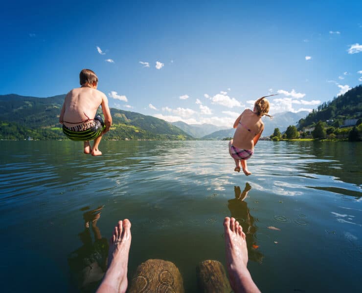 kids jumping in lake