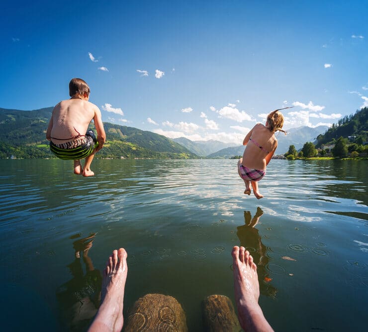 kids jumping in lake