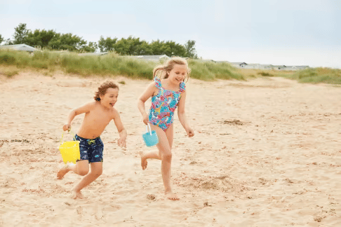 kids running on beach