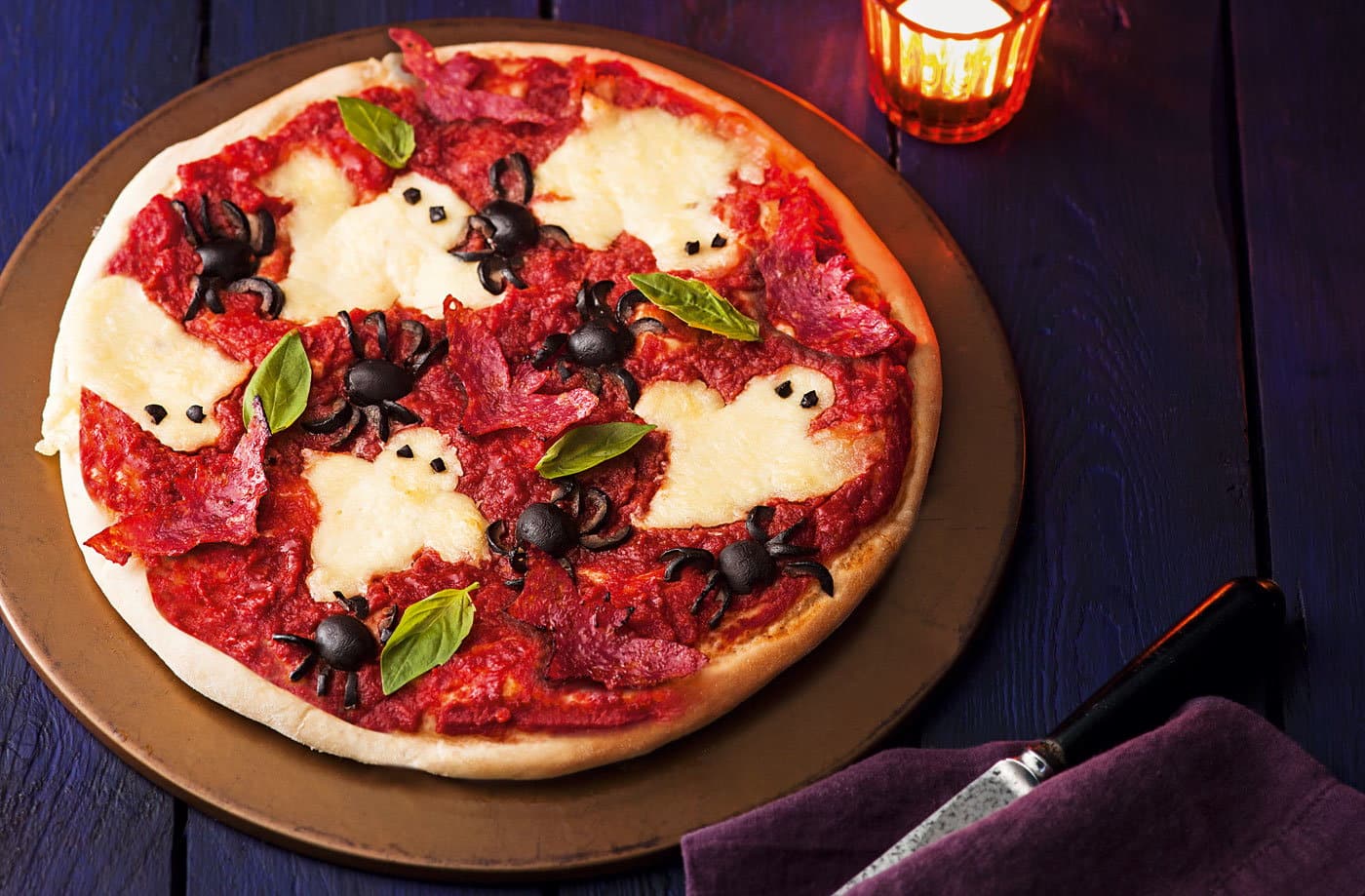 haunted pizza with olive spiders and cheese ghosts