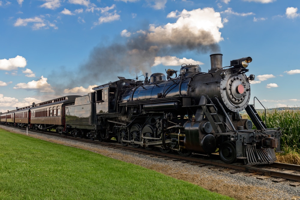 black steam train along train track