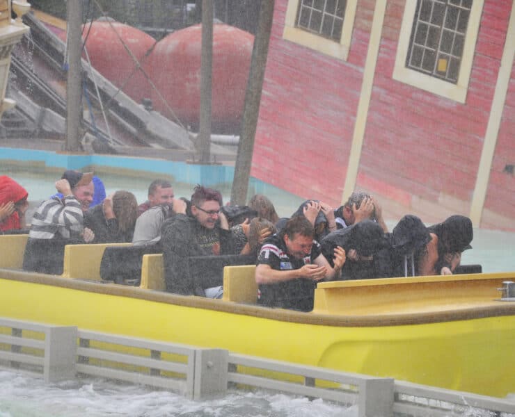 People on a theme park water ride