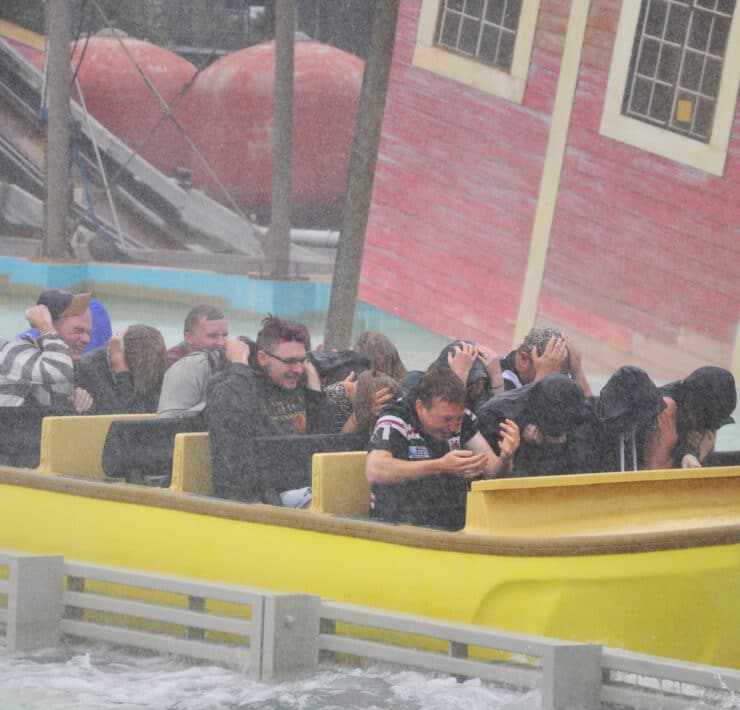 People on a theme park water ride
