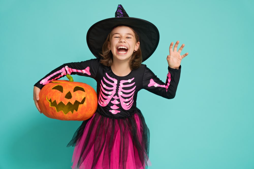girl dressed as a witch for halloween