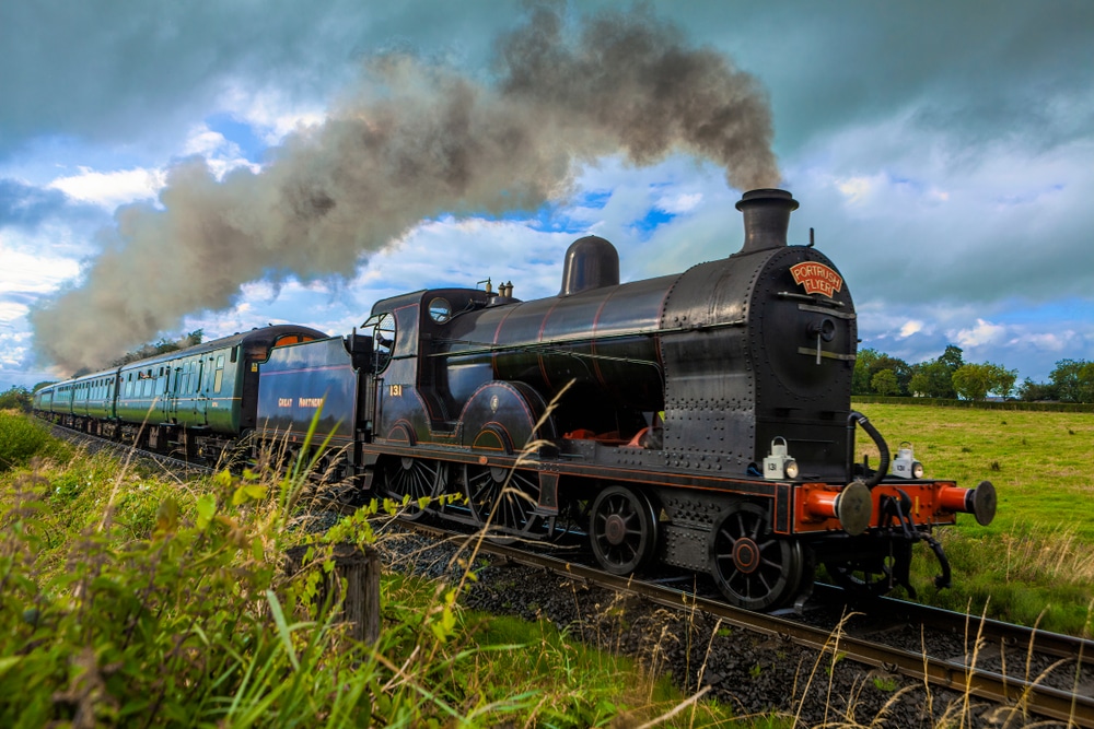 smoke coming out of steam train on train track