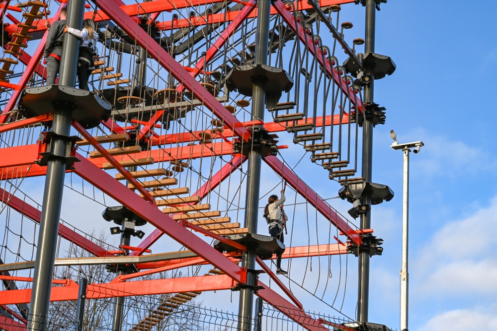 a person climbing along an obstacle course