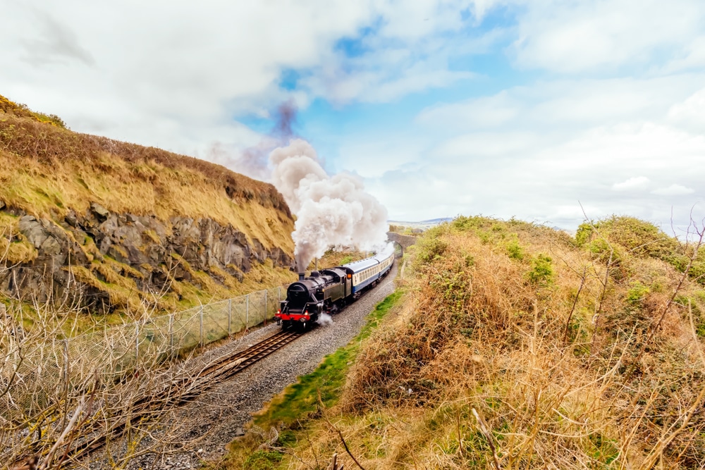 steam train travelling across countryside