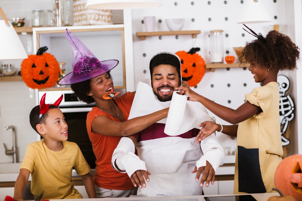 family together on halloween making costumes