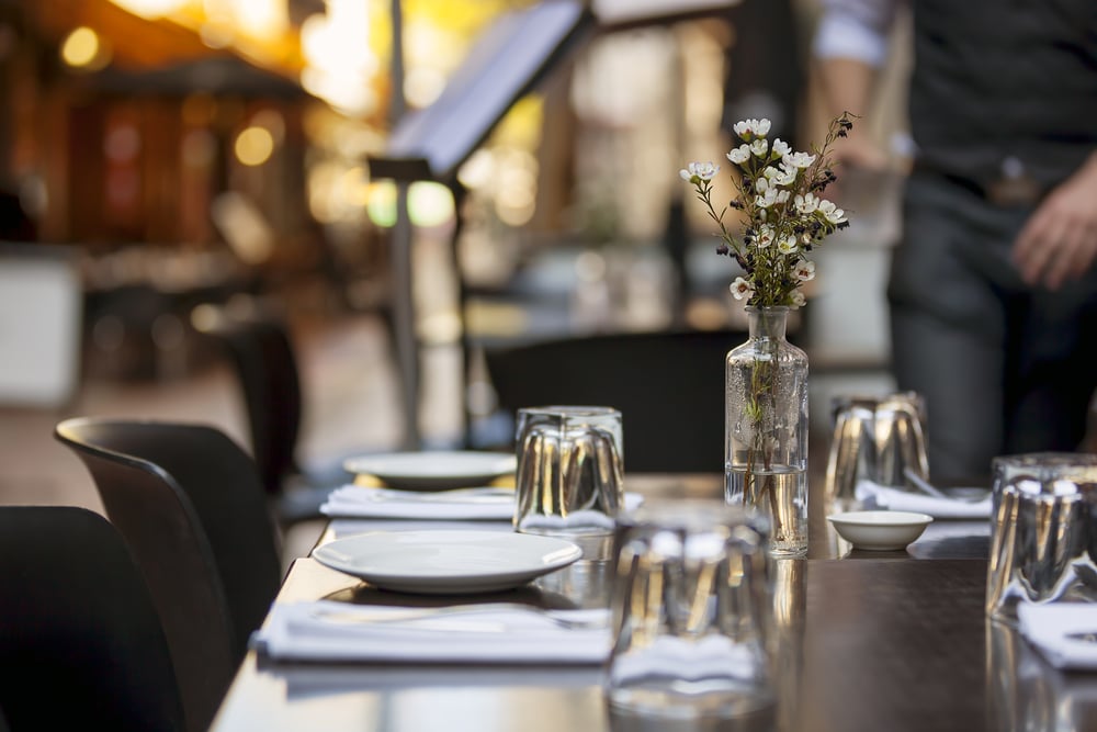 outdoor dining with plates and a nice setting