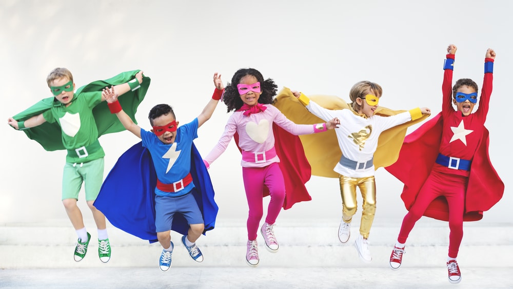 kids dressed in superhero costumes
