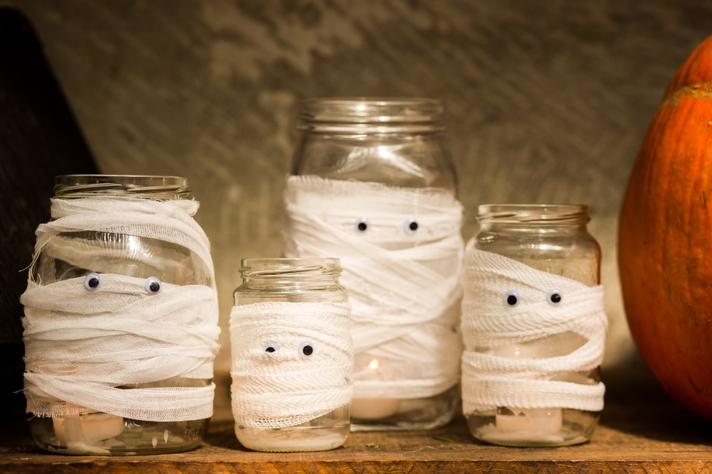 homemade halloween decorations of zombie glass jars