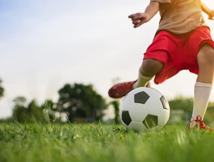 player kicking a ball