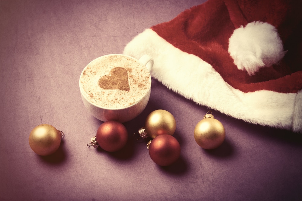 a santa hat, latte and christmas baubles