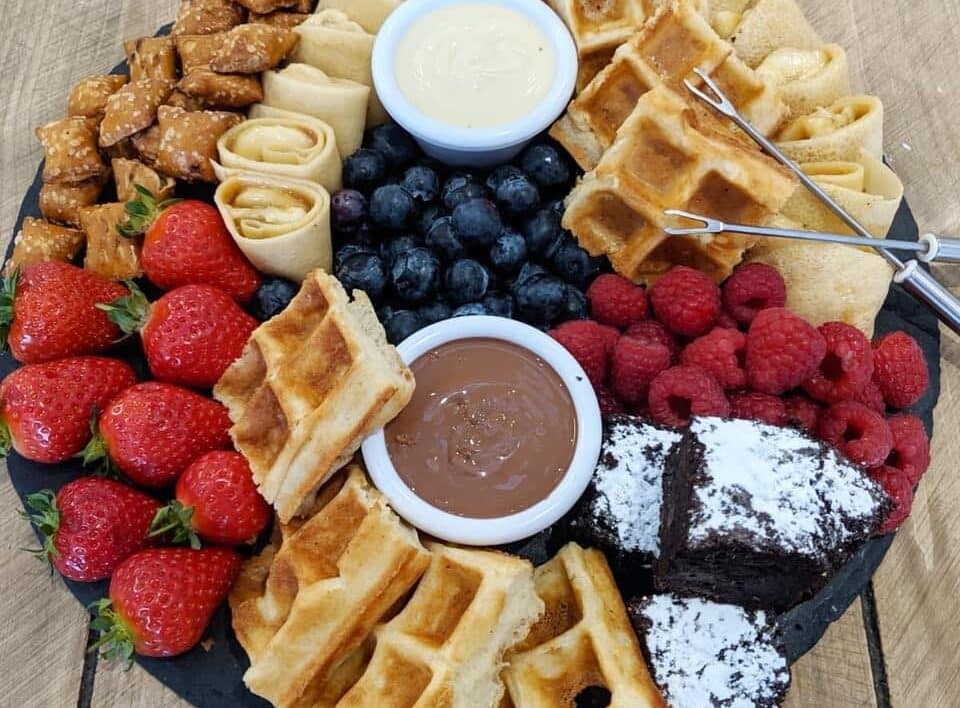 One of Crepe Escape's small crepe platters with chocolate, waffles, strawberries, blueberries and white chocolate
