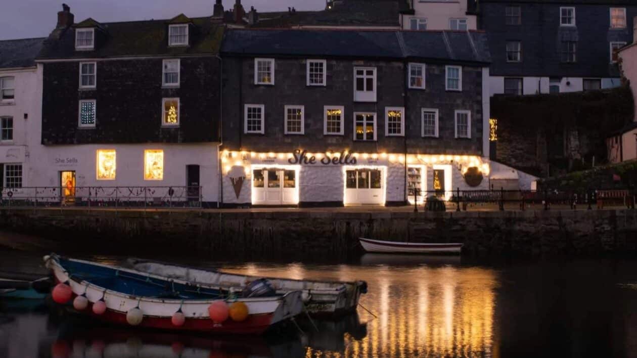 Picture of the She Sells creperie in the evening by the harbour.