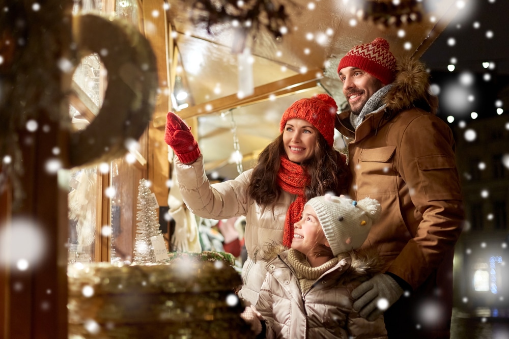 family looking at christmas market gifts
