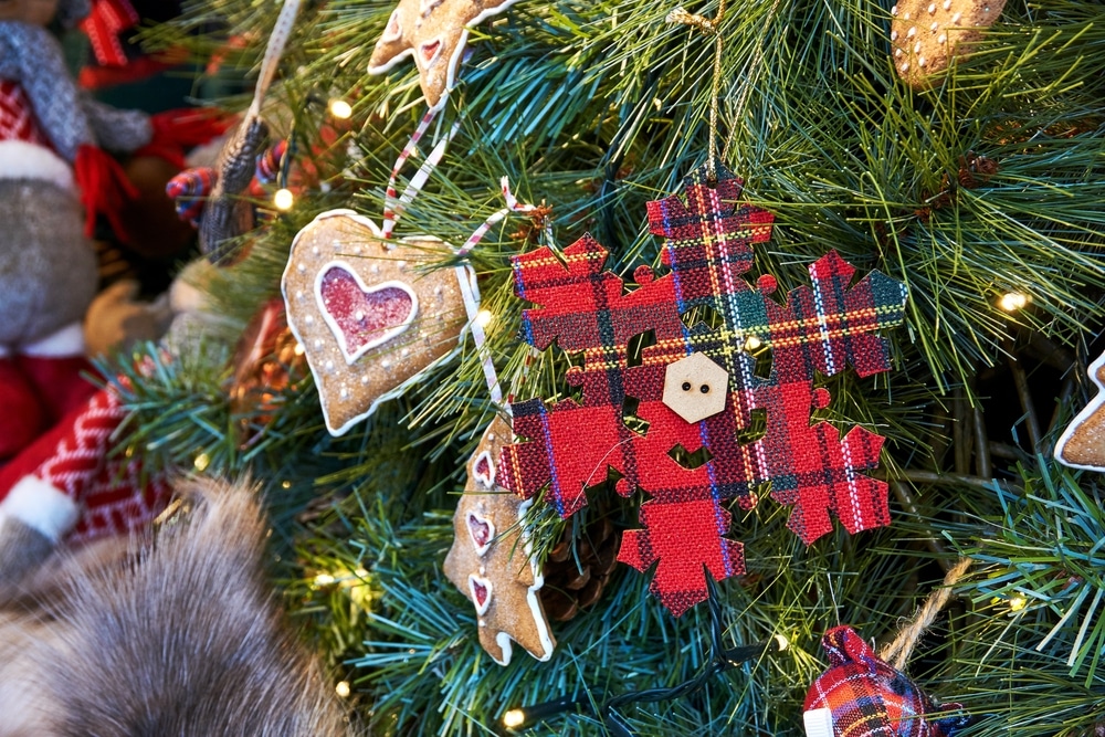 close up of scottish snowflake decorations on christmas tree