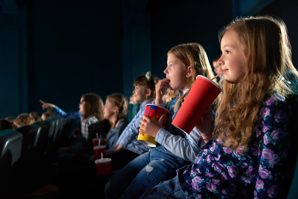 group of kids watching a film