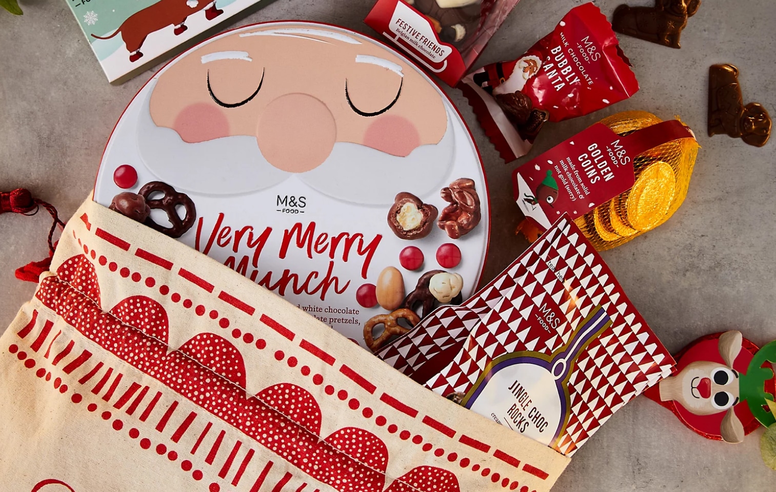 an m&s christmas hamper of chocolates, pretzels and a santa sack