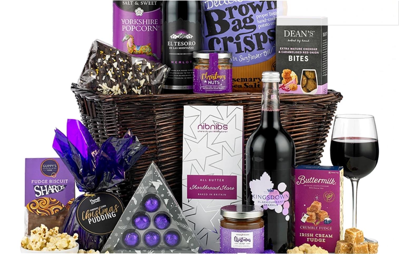 hamper filled with luxury treats, wine, sparkling drinks and savoury treats