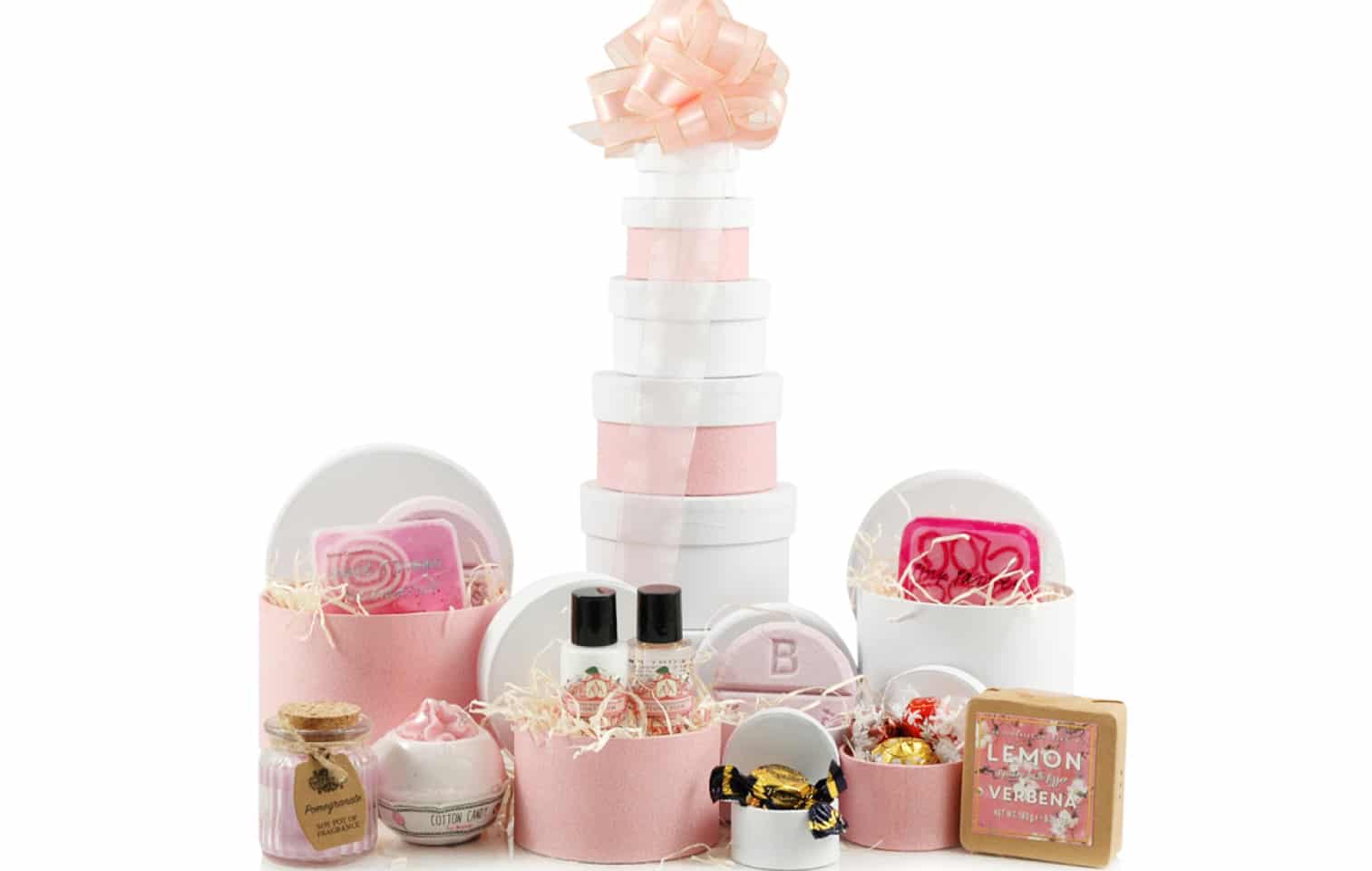 a bath and pamper tower set with bamb bombs, a candle and bath fizzers