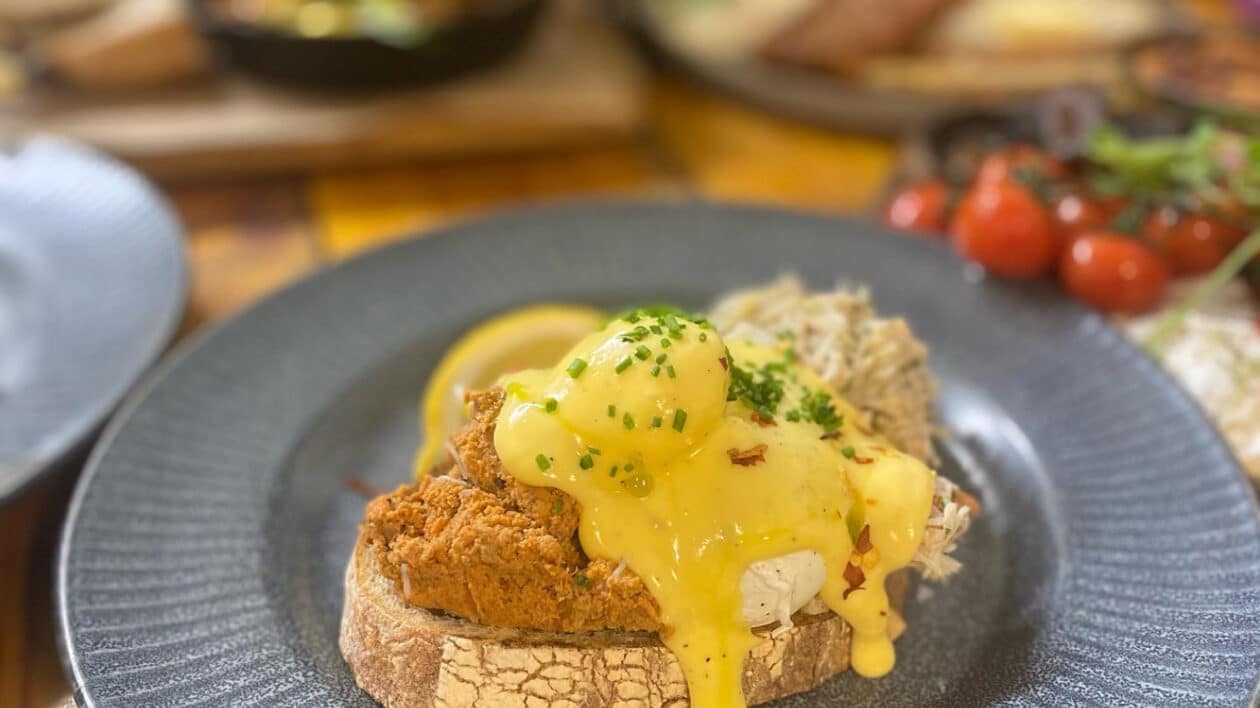 eggs benedict and chicken on sourdough bread