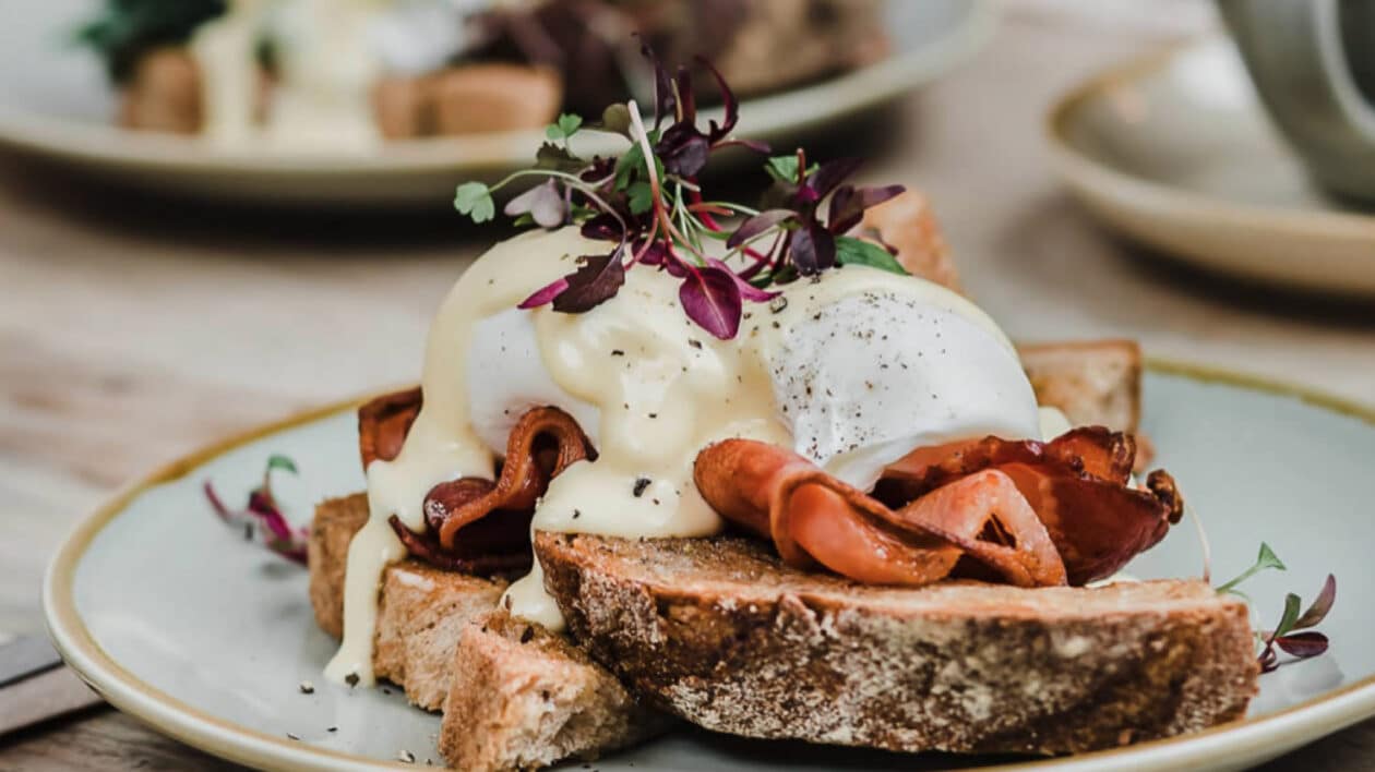 smoked meat and eggs benedict on sourdough bread