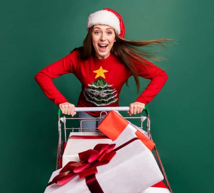 woman with a trolley of christmas gifts
