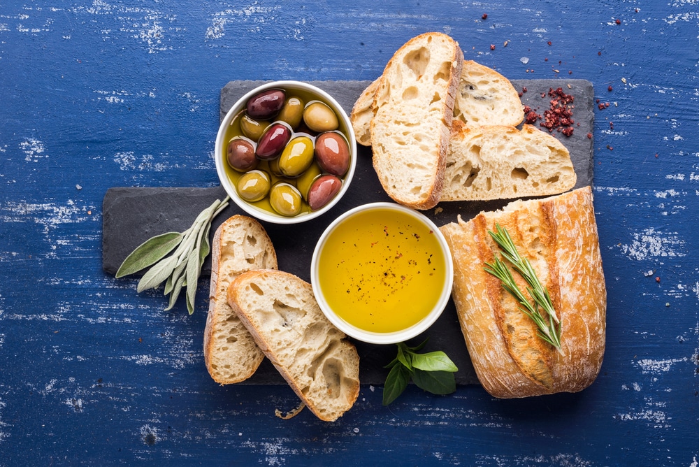 a selection of bread, olives and drizzle