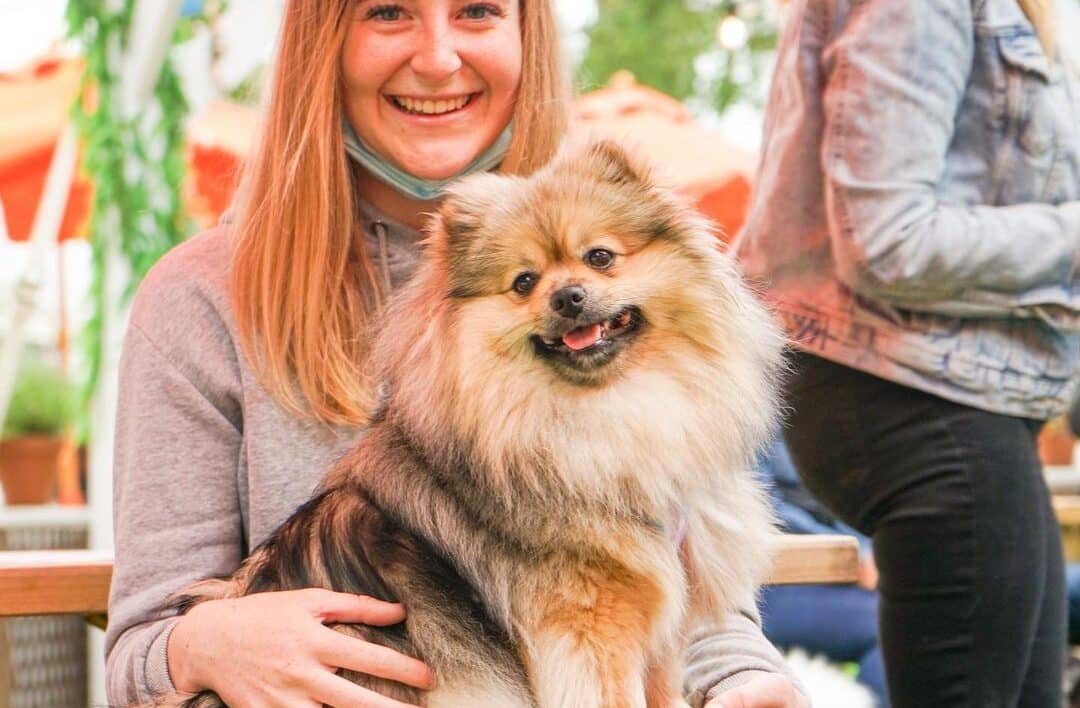 Girl with pomeranian dog