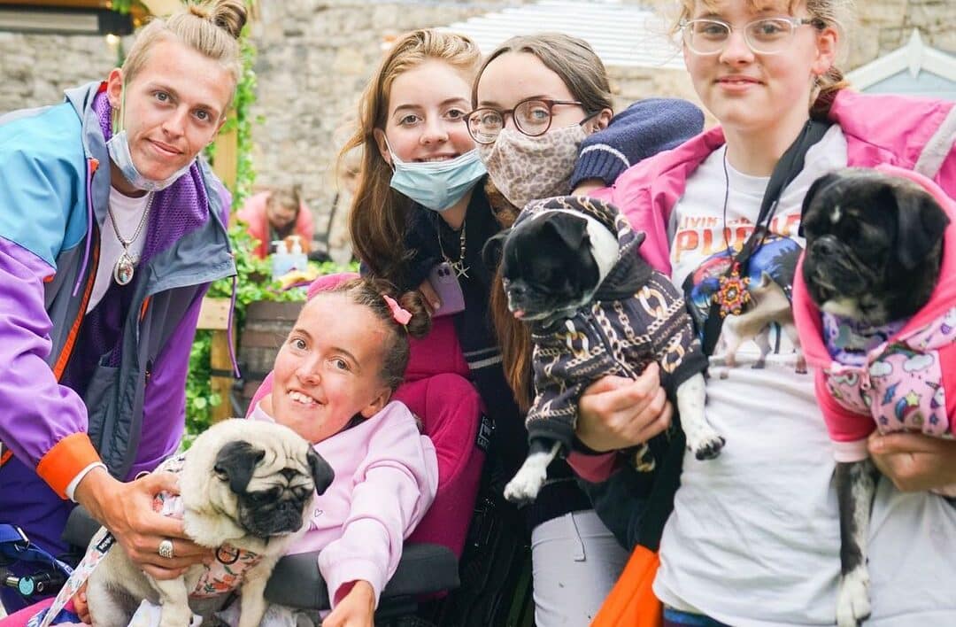 Group of teens with dogs