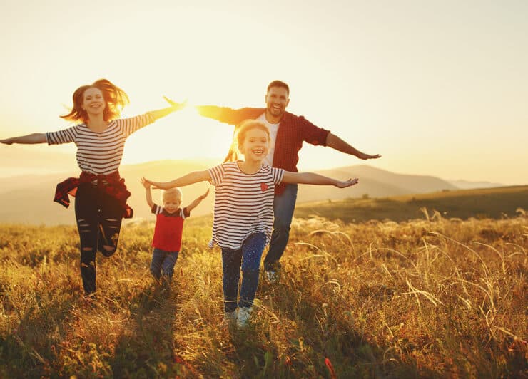 a family running through a field