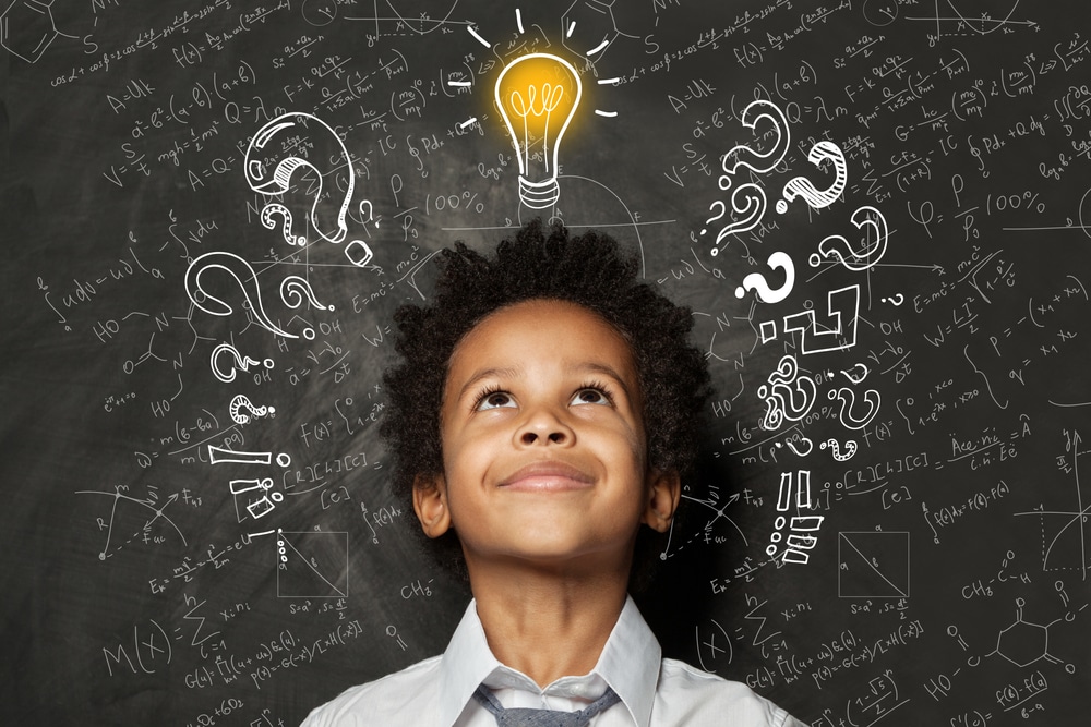 Boy having a light bulb moment - fun riddles for kids to boost critical thinking