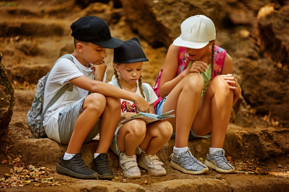 kids looking at a map